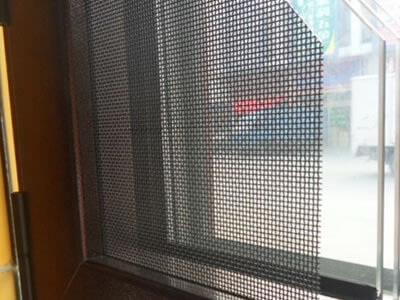 A large piece of 316L stainless steel security screen is fixed to show for customers.